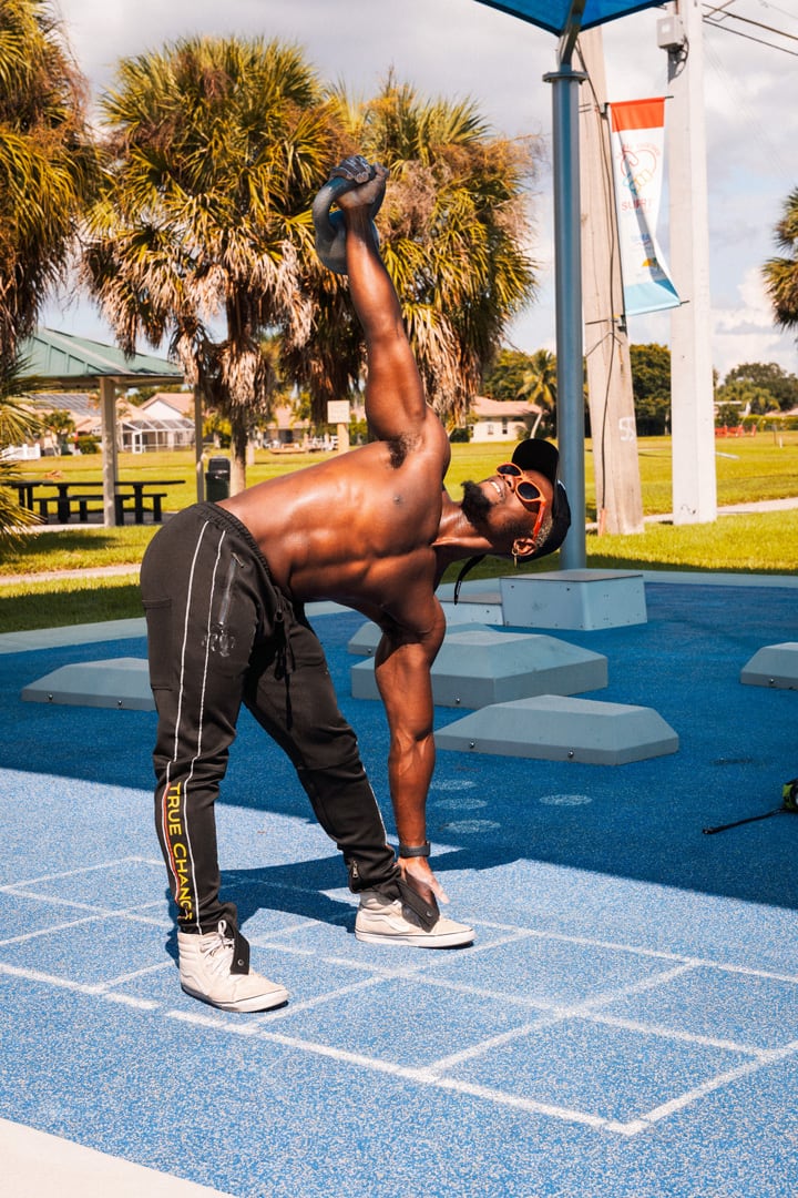 The coach exercising at an outdoor facility.